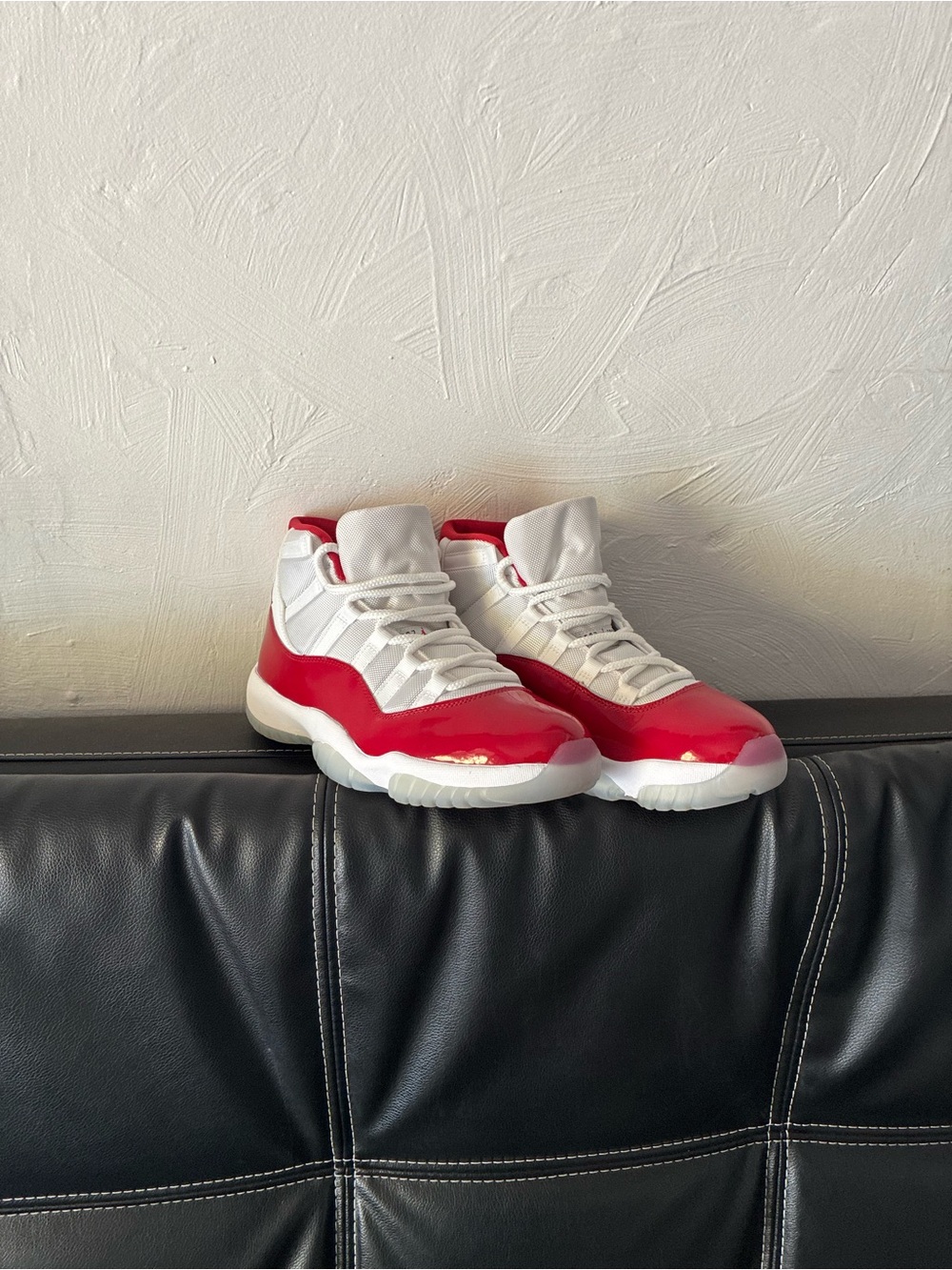 Jordan 11 cherry red color way